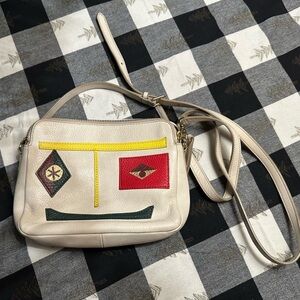 Fossil Cream Crossbody Bag with Red and Yellow Accents